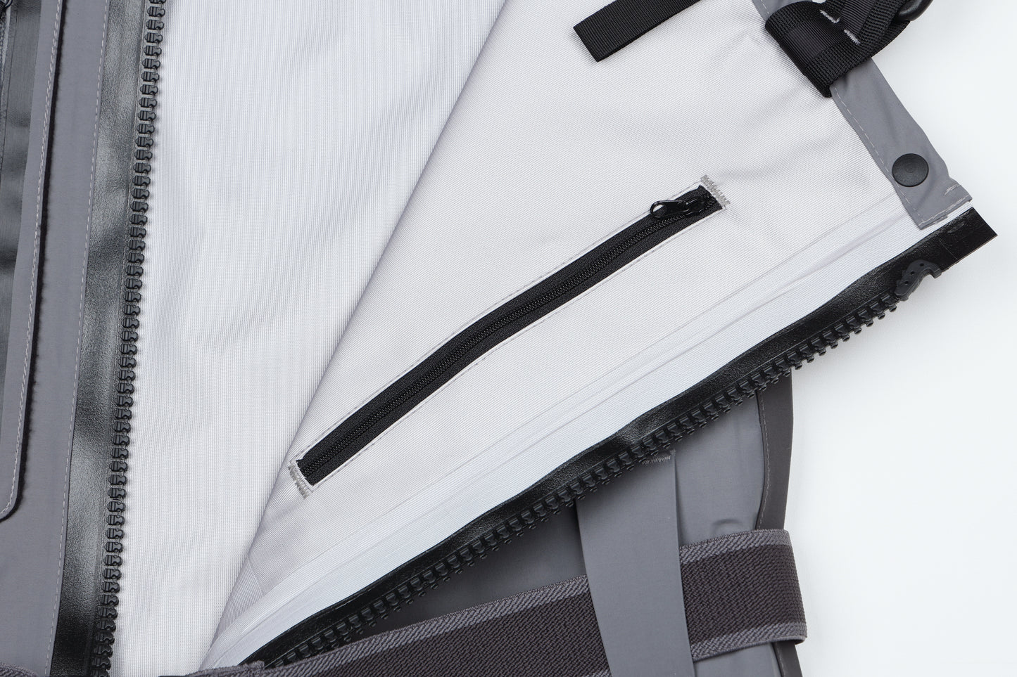 Interior view of BRIVER wader featuring a water-resistant flip-out security pocket and breathable soft-touch lining